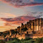 Stunning view of Mehrangarh Fort during a vibrant sunset in Jodhpur, India., tags: indien und - pexel